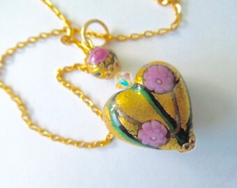 Murano glass pendant with gold and pink millefiori heart with Swarovski crystal and gold chain.