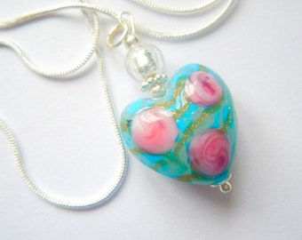 Murano Glass pendant with blue and pink rose Murano glass heart bead and sterling silver chain.