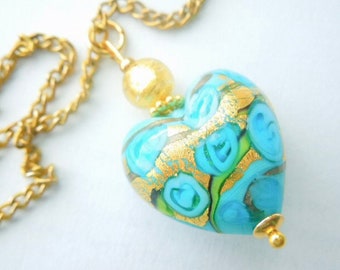 Murano Glass pendant with aquamarine blue Murano glass heart bead and gold chain.