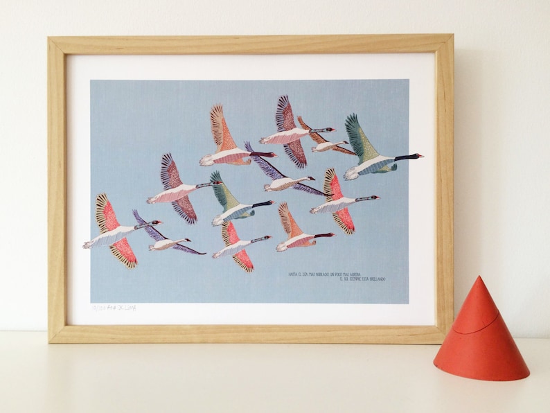May include: A framed print of a flock of geese flying in formation against a light blue sky. The geese are depicted in various shades of pink, blue, and green. The print is titled "When I.C. On The Island In The Arctic Ocean" and is signed "C.R. ETHERIDGE 2018".