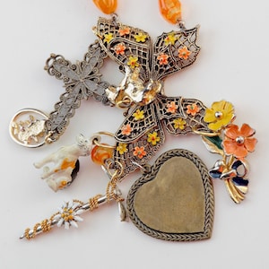 OOPS A DAISY  Orange and Yellow Beads and Charms with Butterfly and Cross, Calico Cat, Shaggy Dog