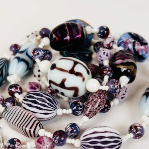 UNDER NIGHT CLOUDS Deep Purple Vintage Beads Accented in Crisp White Line the Neck of This Piece