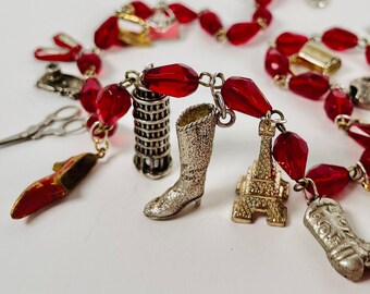 FASHION WEEK Stylish Vintage Charms Line the Neck of This Piece in Red, Gold, and Silver
