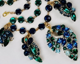 PLIQUE A JOUR Blue and Green Cabochon-Filled Former Brooches and Earrings Hang from Colorblocked Links
