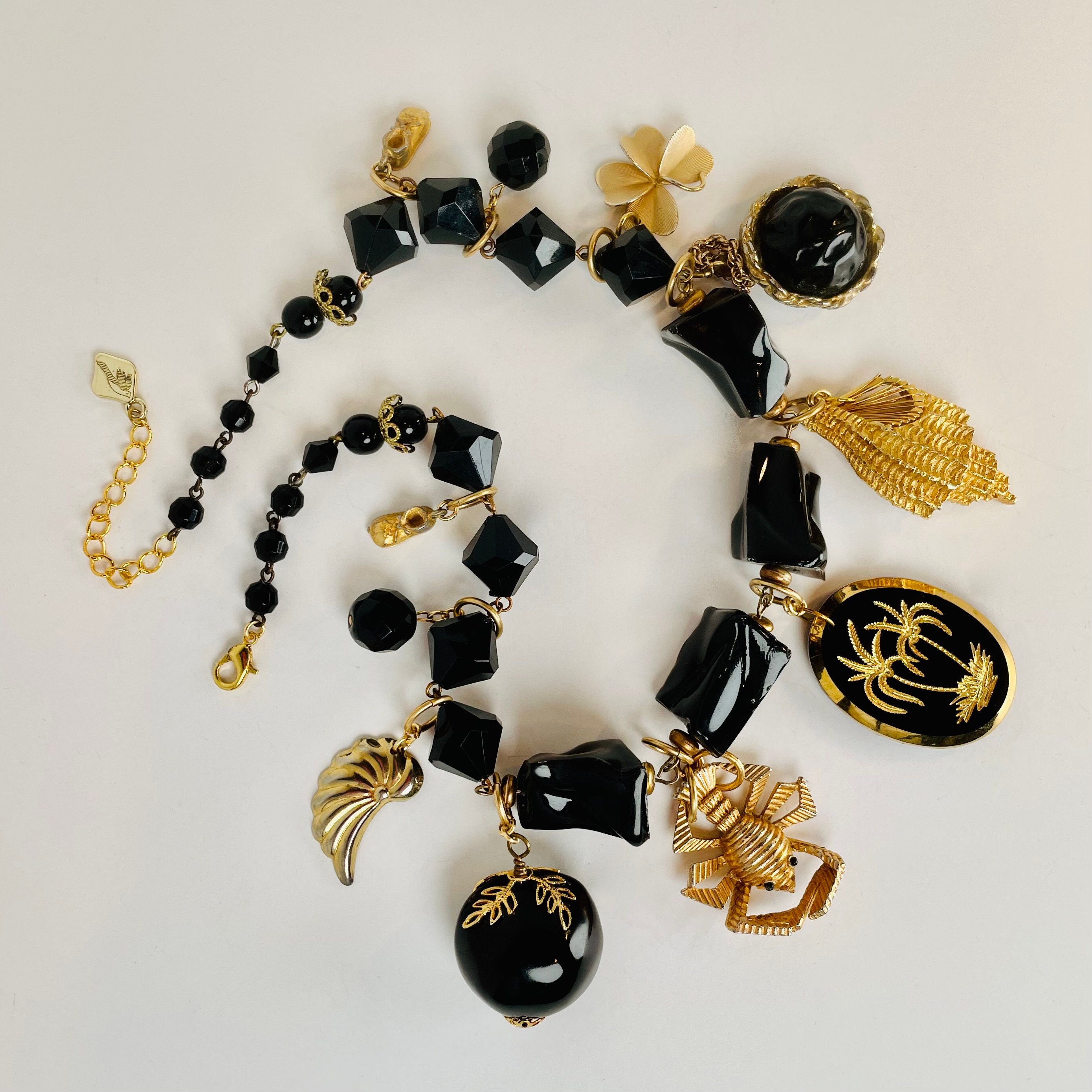 NATURAL WONDERS Seashell, Palms, Obsidian-Like Resin Beads, a Crustacean, a Clover Leaf, a Nut, and Baby Shoes on This Statement Necklace