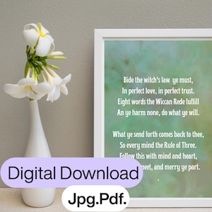 May include: A white framed wall art print featuring the Wiccan Rede text in white font against a soft green watercolor background. The text reads: Bide the witch's law ye must, In perfect love, in perfect trust. Eight words the Wiccan Rede fulfill.