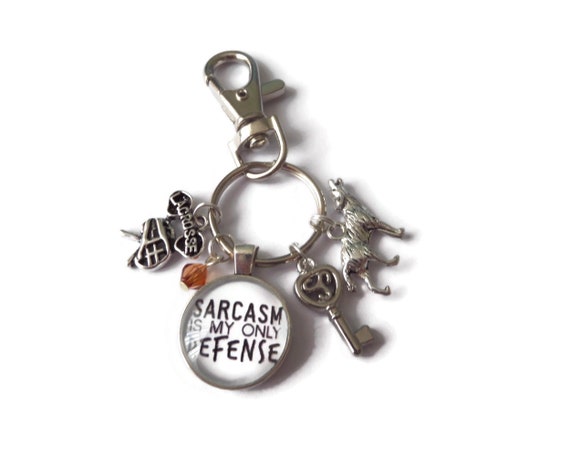 wolf lacrosse novelty gift glass cabochon designs handmade by Sandy Kisses UK Sarcasm is my only defense bag clip keyring Teen Wolf themed keychain