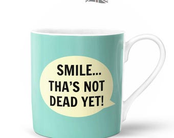 Smile... Tha's Not Dead Yet! Mug  | Bone China in Gift Box | Fired & Decorated in the UK | Northern Yorkshire Funny Dialect Saying