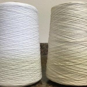 8/2 cotton weaving yarn is a staple amongst weavers since it is a very versatile weaving yarn. It is perfect for weaving dish towels, scarves, pillows and other items. This cotton weaving yarn on cones has 3360 yards per pound