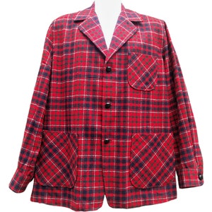 May include: A red, black, and white plaid jacket with a button-up front and two large patch pockets. The jacket has a classic, casual style.