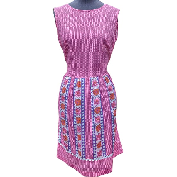 Vintage 50s or 60s pink polka dot dress with purple and orange apron detail