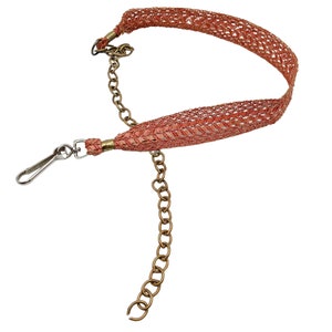 Vintage 70s or 80s coral orange pink vinyl plastic weave with silver and gold tone metal chain belt