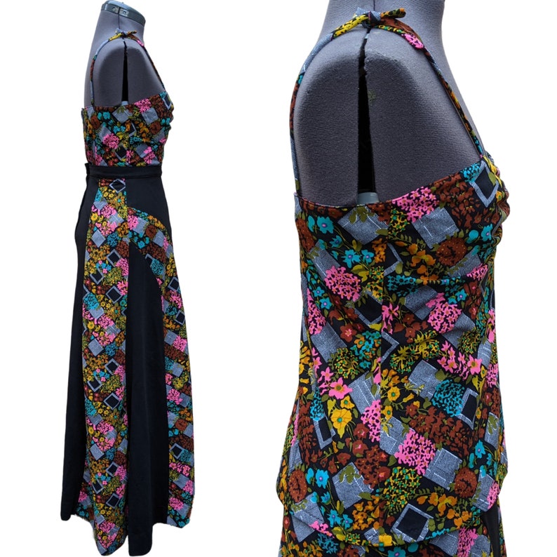 May include: A black and floral print two-piece dress with a fitted top and a flowing skirt. The top has a scoop neck and thin straps. The skirt has a high waist and a flowing A-line silhouette.