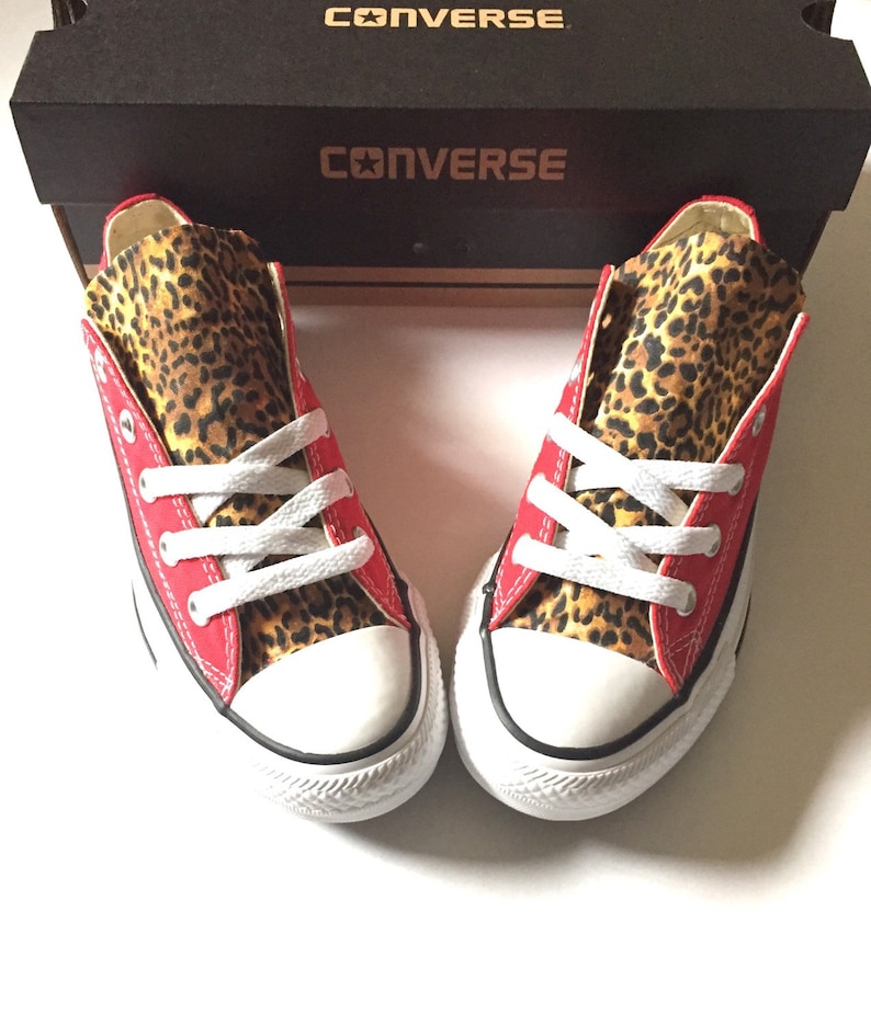 red converse with cheetah print tongue