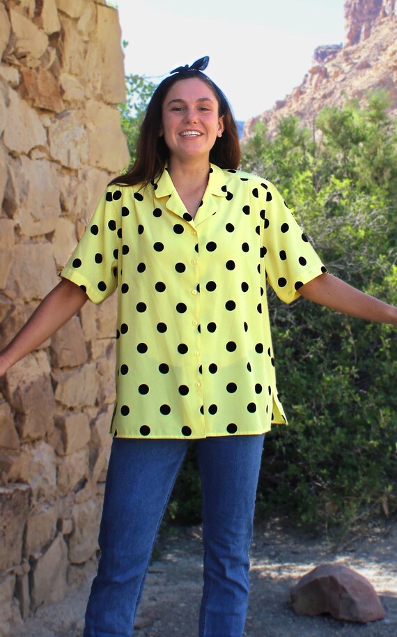 yellow and black polka dot shirt
