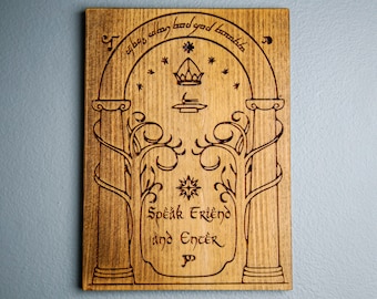 May include: A wooden sign with a carved image of a doorway with two pillars and vines. The sign reads "Speak Friend and Enter" in a stylized font.