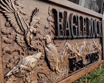 May include: A wooden sign with a carved eagle design and the text "Eagle Rock Est. 2015".