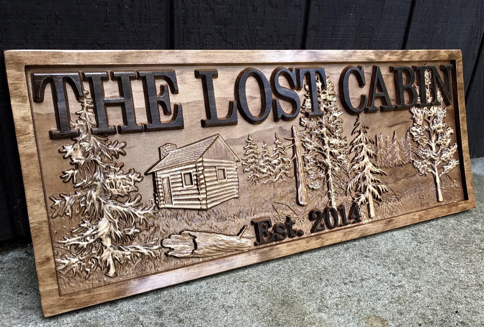 carved rustic sign for cabin home