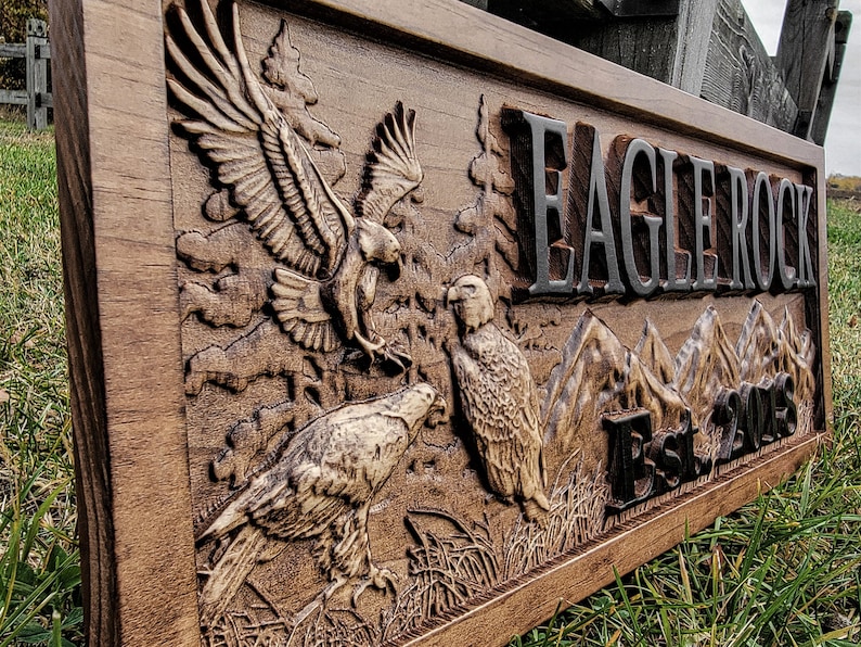 May include: A wooden sign with a carved eagle design and the text "Eagle Rock Est. 2015".
