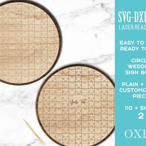 以下が含まれることがあります： 木目模様の丸い木製パズルピースが2つ。パズルピースは空白ですが、1つには「Your Text」というテキストが書かれています。画像には、「SVG-DXF-EPS レーザー対応ファイル 簡単な作成 カット済み 円形ウェディングサインブック プレーン + カスタマイズ可能なピース 110 + サイン 2 OXEE」というテキストが添えられています。
