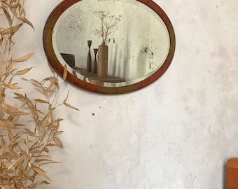 Beveled oval wall mirror