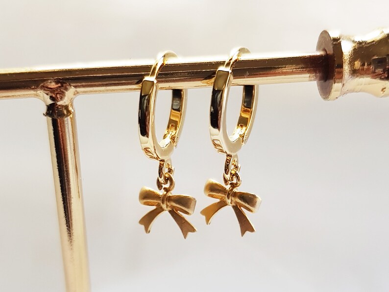 huggie hoop earrings with charm bow hoop earrings