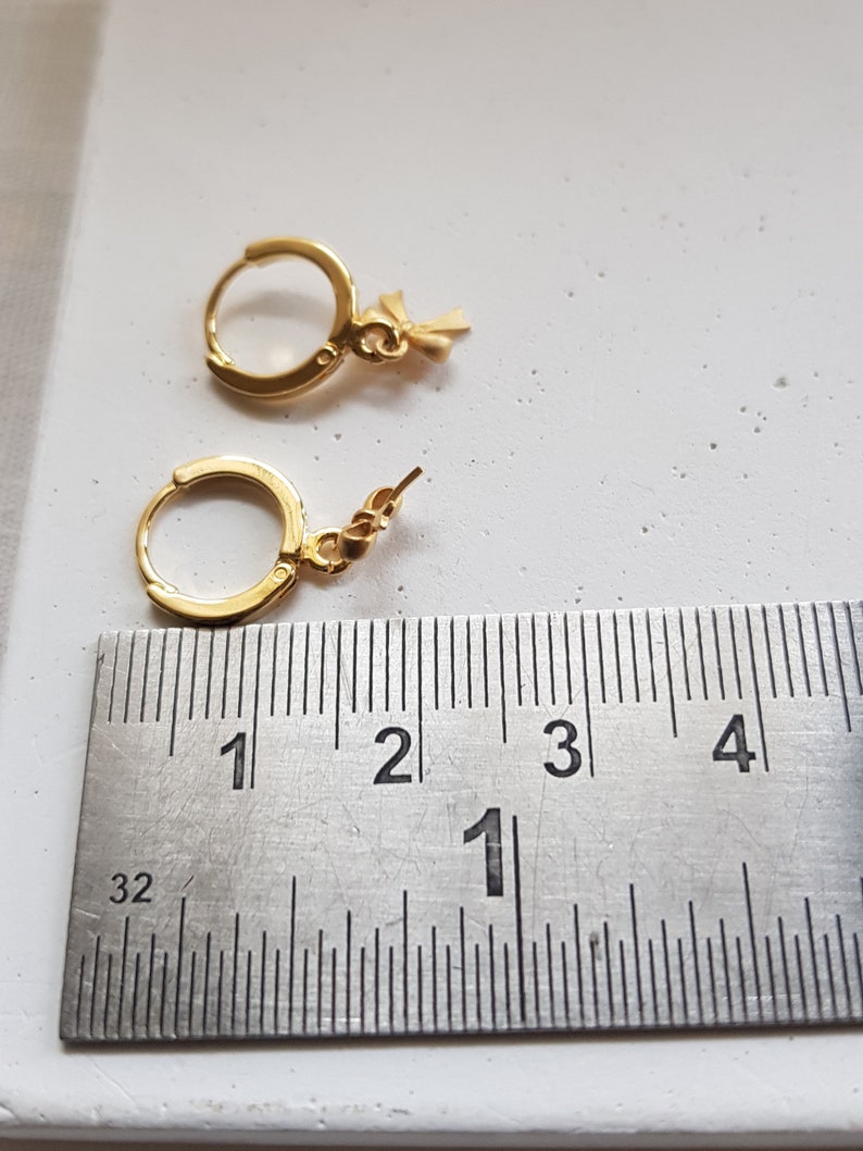 huggie hoop earrings with charm bow hoop earrings