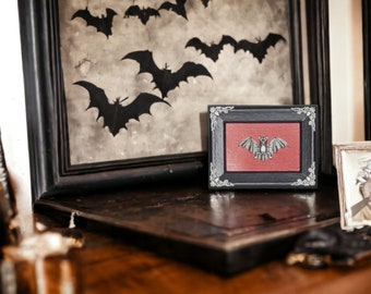 Framed Silver Bat with Filigree Embellishments