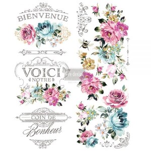 May include: A vintage-style transfer sheet featuring floral designs and French text. The sheet includes a variety of floral motifs, including roses, daisies, and butterflies. The text on the sheet reads "Bienvenue", "Voici Notre", and "Coin de Bonheur".