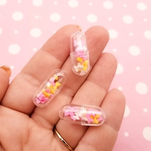 10 cabujones de cápsulas de pastillas transparentes de arcilla polimérica con forma de lazo para San Valentín, cápsula de plástico, para escribir tu propio mensaje, n.° 1231a