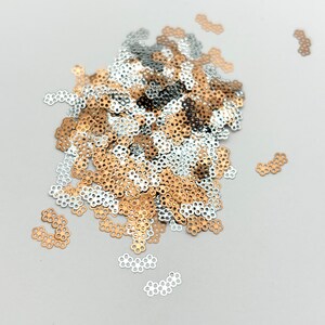 a pile of sequins sitting on top of a table