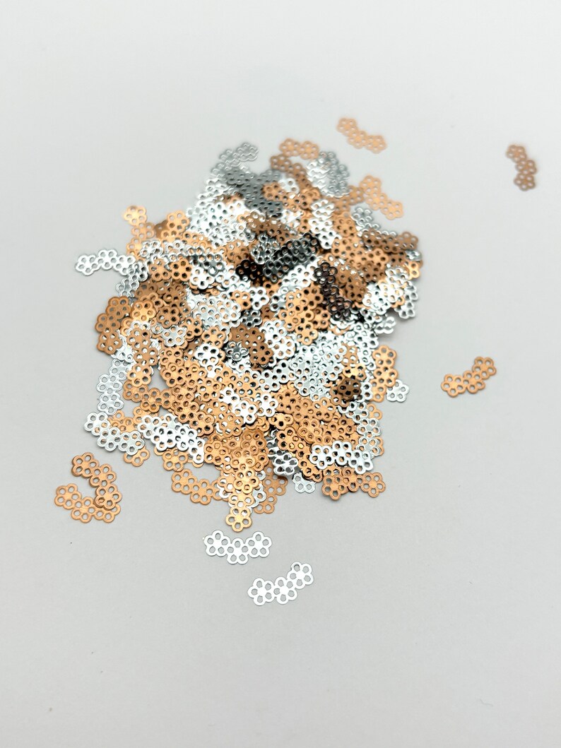 a pile of sequins sitting on top of a table