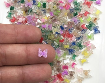 20 flerfärgade plattbakade resinspik-fjärilscabochoner, 7 mm akrylplast-platta baksida fjärilsflickslipade cabochoner, små insektsfjärilar 504