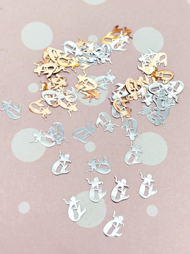 a pile of silver and gold letters and numbers