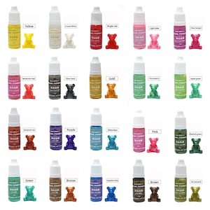 May include: A set of 20 small bottles of pearl pigment in various colors, including yellow, red, pink, green, blue, and purple. Each bottle has a small bear figurine next to it, representing the color of the pigment.