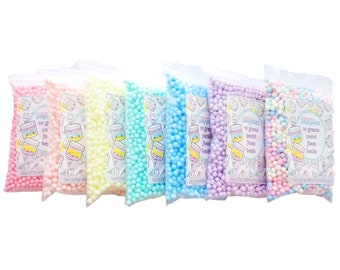 May include: Six small bags of pastel colored foam beads. Each bag contains 20 grams of beads and has a label that says "Supplies 20 grams pastel foam beads".