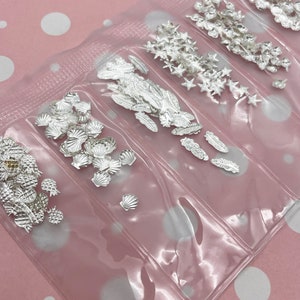 150-300 Assorted Tiny Silver Toned Nail Cabochon Kit, Shells, Stars, Pineapples Feathers Seahorses Pineapples L91