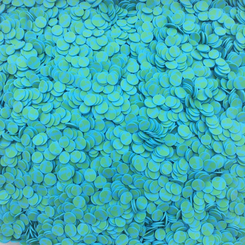 May include: A large quantity of blue and green confetti circles. The circles have a white polka dot pattern.