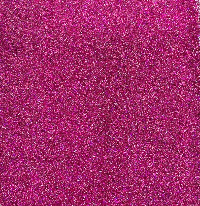 May include: A close-up of a sparkly pink glitter background.
