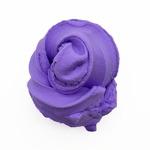 May include: A swirl of lavender-colored slime against a white background. The slime has a textured, almost velvety appearance, with a central spiral and layered edges. The color is a vibrant, medium purple.