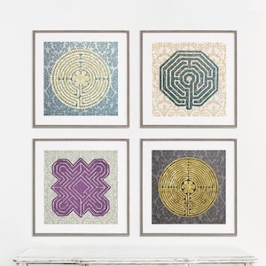 May include: Set of four framed prints featuring different labyrinth designs. Each print has a gold labyrinth on a patterned background. The patterns are blue, beige, purple, and gray.