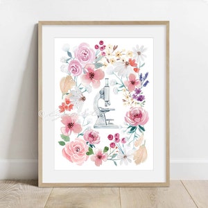 May include: A watercolor illustration of a vintage microscope surrounded by pink, white, and purple flowers. The flowers are arranged in a circular pattern around the microscope, creating a floral wreath.