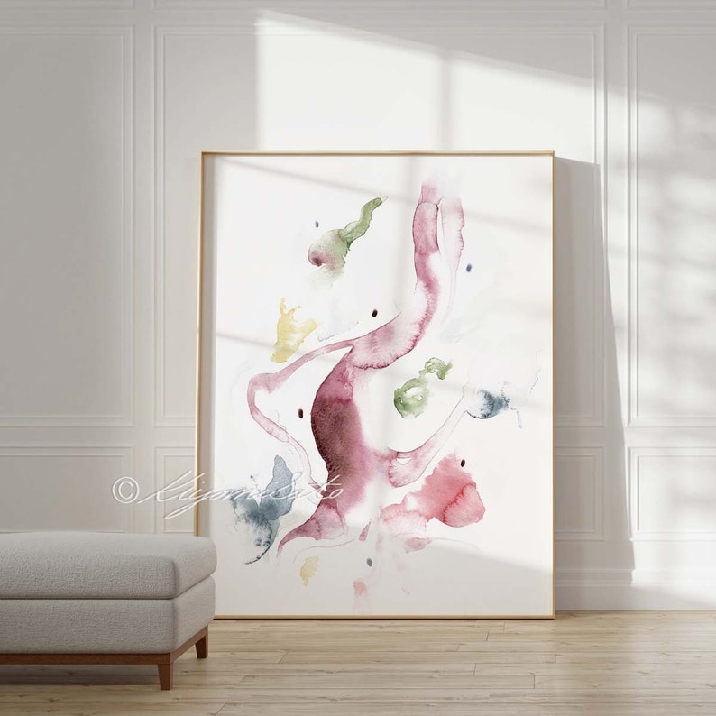 May include: Abstract watercolor painting with a flowing, organic design in shades of pink, red, green, and blue. The artwork features a central, swirling shape with smaller, scattered shapes around it.
