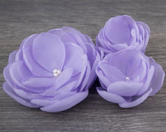 Three purple flower clips