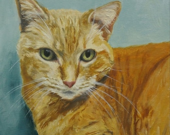 May include: A painting of a ginger cat with green eyes, lying on a blue background. The cat is looking directly at the viewer.