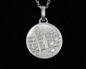 Médaille gravée sur le thème de la musique en argent massif, 18,5mm