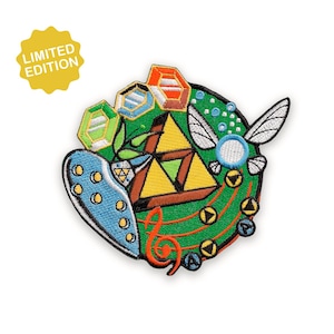 Puede incluir: Parche bordado con un diseño colorido que incluye una Trifuerza, notas musicales y un hada. El parche incluye el texto "LIMITED EDITION" en forma de estrella amarilla. El parche está sobre un fondo blanco.