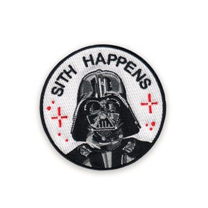 May include: Round, embroidered patch featuring Darth Vader's helmet. The patch has the text "SITH HAPPENS" in black letters on a white background. Red cross-shaped accents are on either side of the helmet.