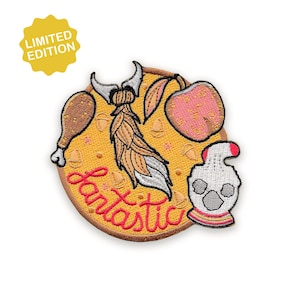 May include: Embroidered patch with a yellow background and a brown border. The patch features a cartoon design with a drumstick, apple, and a skull-like figure. The word "Fantastic" is written in red script. A yellow "Limited Edition" badge is in the upper left.