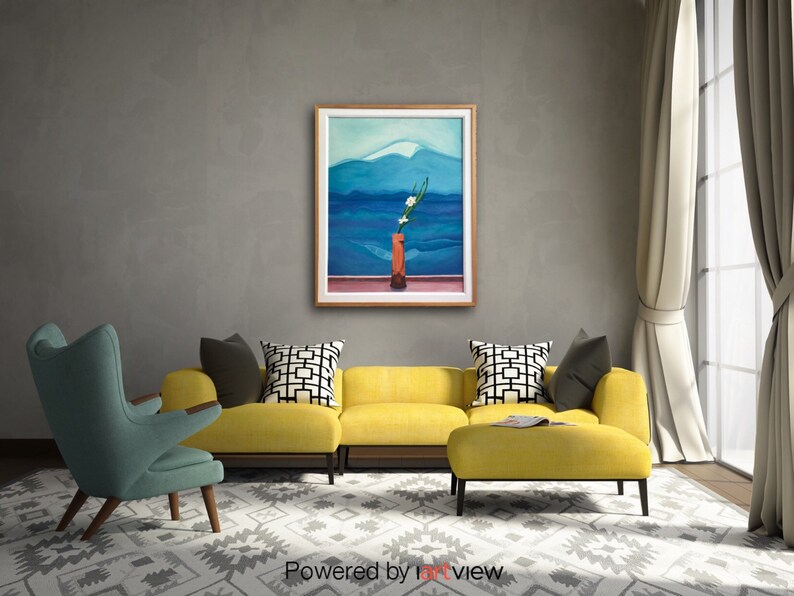 May include: A yellow sectional sofa with a matching ottoman in a living room setting. A framed painting of a mountain landscape with a vase of white flowers is hanging on the wall.